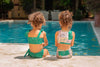 Girls Sitting By The Pool In Green Paisley Allegra Bikini